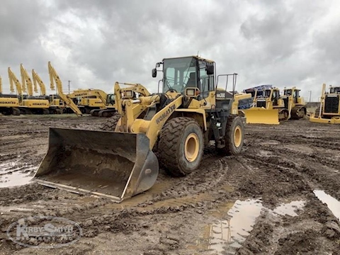 Used Loader under cloudy sky for Sale