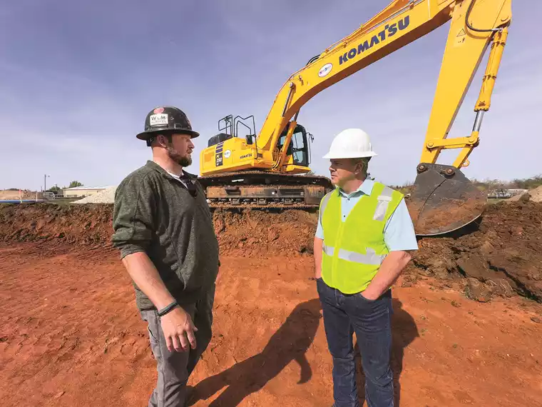 C & Z Services owner Zach Blevins (left) talks with KSM Territory Manager Ryan Bebee. 