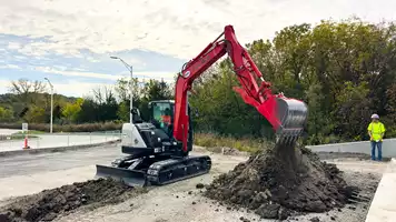 An EPIC Concrete Construction operator digs a utility trench with a Link-Belt 80 X3 Spin Ace excavator.