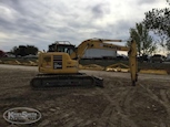 Side of Used Crawler Excavator under cloudy sky for Sale