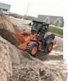 New Loader moving dirt on hill for Sale