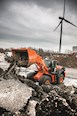 New Hitachi Loader dumping rocks in pile