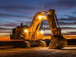 New Excavator Shovel under setting sun for Sale